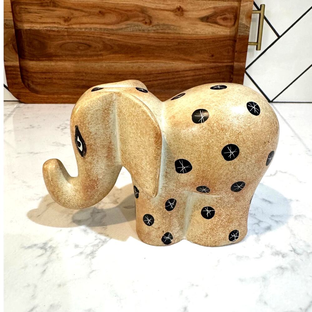 handcrafted Kenyan soapstone elephant figurine natural finish etched starburst
